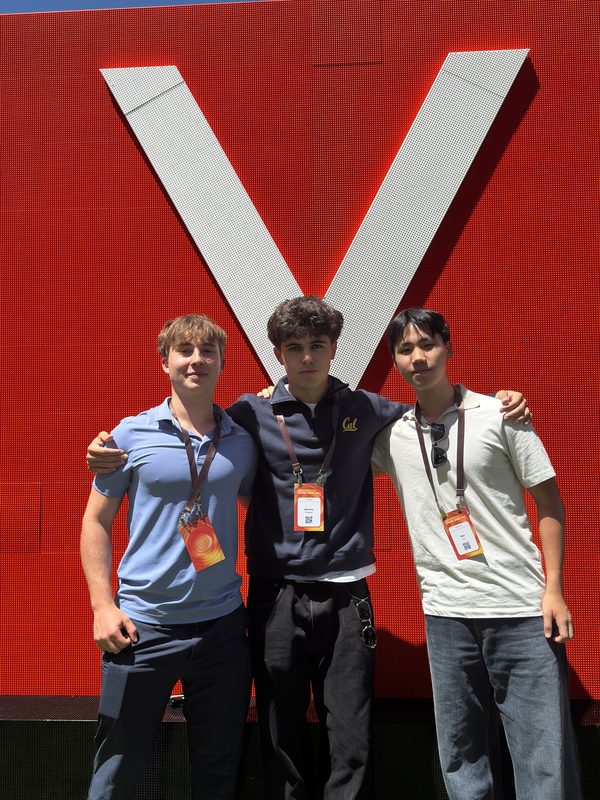 Adrian Erlikhman with two other attendees at Y Combinator Startup School 2026