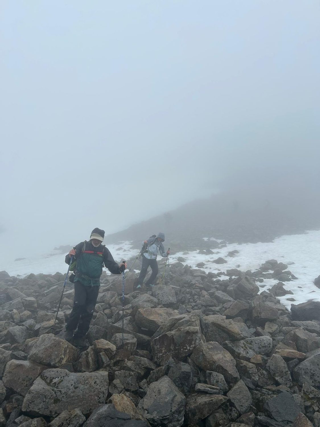 Adrian hiking a foggy ridge
