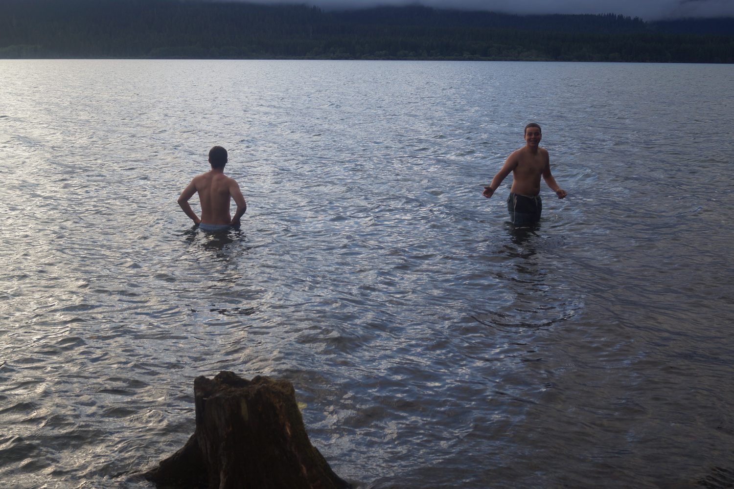Adrian swimming in a lake